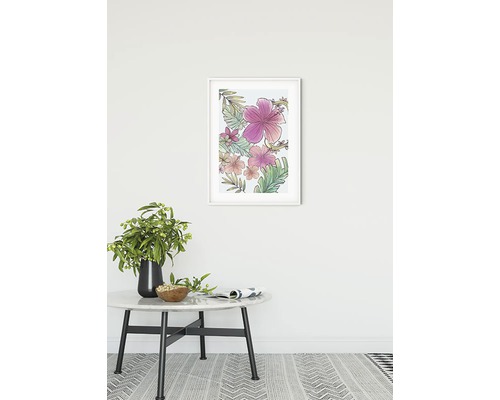 Gerahmtes Wandbild mit Blumenmotiven über einem Tisch