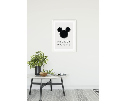 Dekoratives Bild mit der Silhouette von Mickey Mouse in einem Rahmen an einer Wand