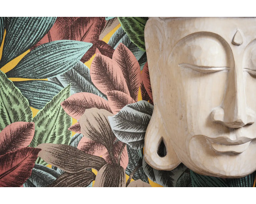 Tapete mit Blättermuster und Buddha Kopf