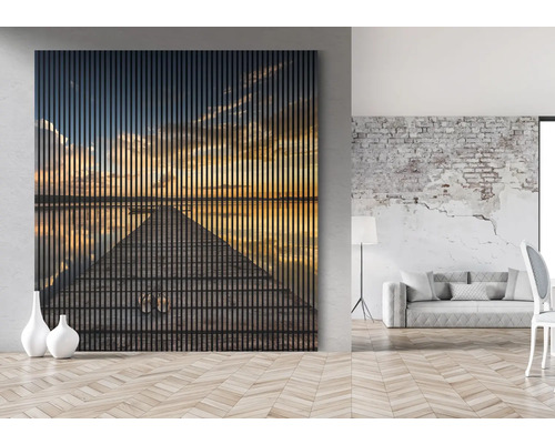 Wandbild mit Sonnenuntergangsmotiv in einem modern eingerichteten Wohnraum