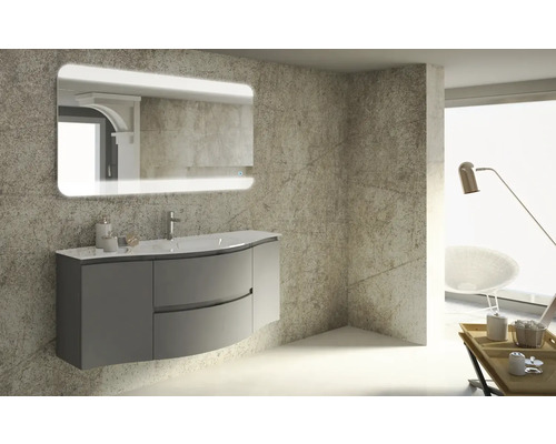 Modernes Badezimmer mit Waschbeckenunterschrank, Waschtisch und beleuchtetem Spiegel