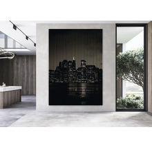 Dekoratives Wandbild mit Skyline-Motiv in einem modern gestalteten Raum.