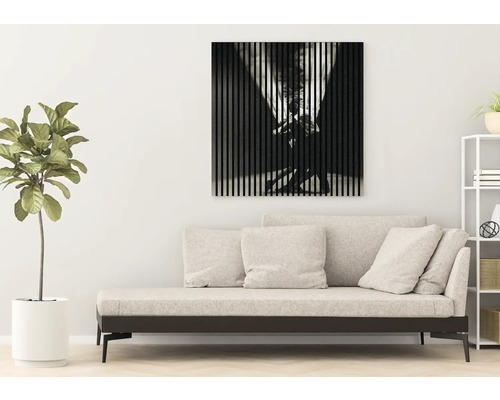 Wohnzimmer mit Sofa, Zimmerpflanze und Wandbild