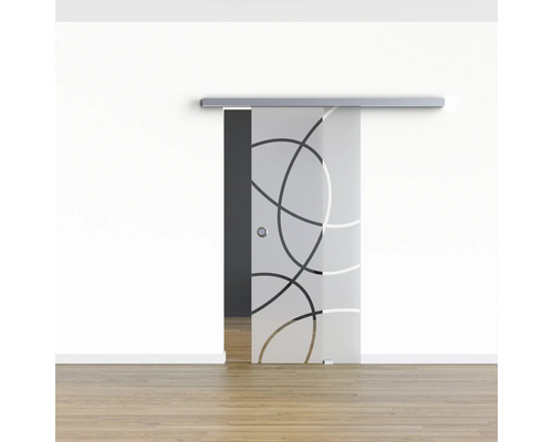 Schiebetür aus Glas mit Kreismuster vor einer weißen Wand