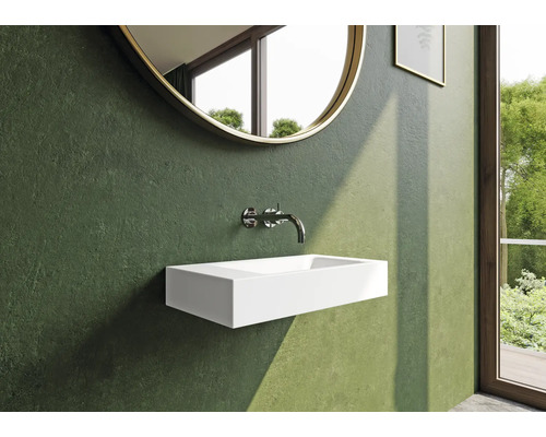Modernes Badezimmer mit Aufsatzwaschbecken, Armatur und rundem Spiegel