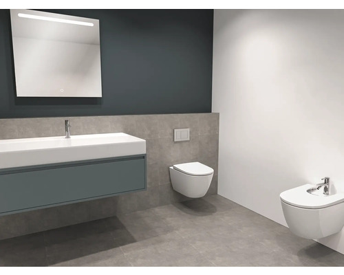 Modernes Badezimmer mit Waschtisch, beleuchtetem Spiegel, Wand-Tiefspüler und Bidet.