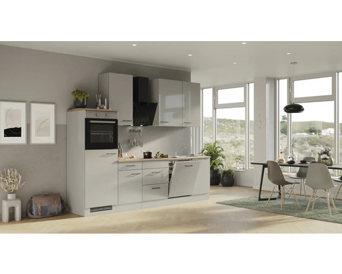 Helle Küche mit Einbaugeräten, Spüle und Esstisch im modernen Stil