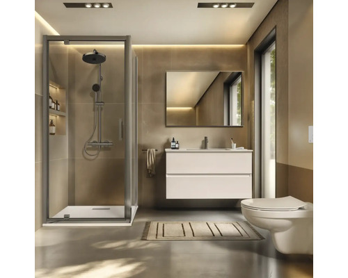 Modernes Badezimmer mit Dusche, Waschtisch, Spiegel und Toilette.