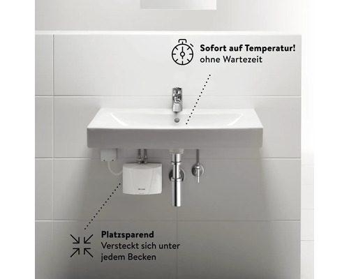 Waschtisch mit Wasserhahn und Untertischgerät zur schnellen Warmwasserbereitung.