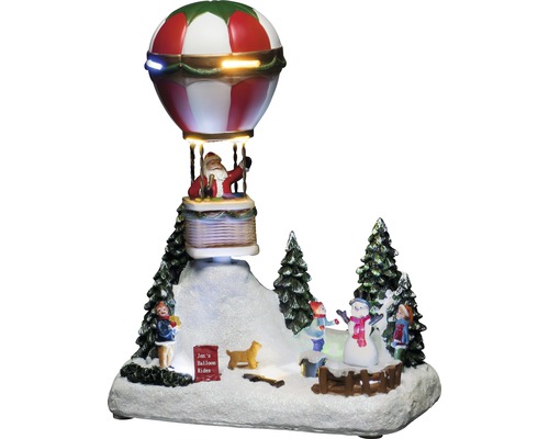 Dekorative Weihnachtsszene mit Weihnachtsmann im Heißluftballon und spielenden Kindern im Schnee.
