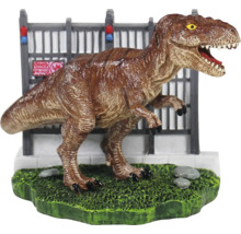 Dinosaurierfigur vor einem Zaun