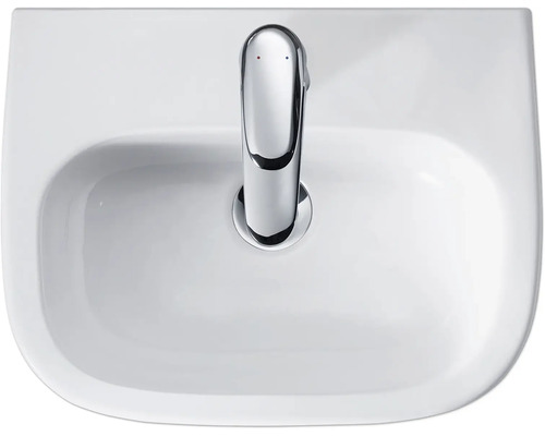 Weißes Keramik-Waschbecken mit Chrom-Armatur von oben