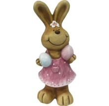 Dekorativer Osterhase mit Kleid und Eiern als Osterdekoration