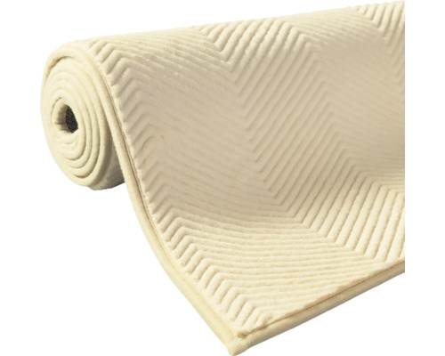 Aufgerollte Teppichunterlage mit Zickzackmuster