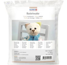 Bastelwatte in einer Verpackung mit einem Teddybär im Vordergrund