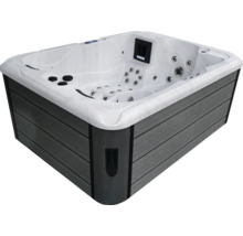 Rechteckiger Whirlpool mit grau verkleideter Außenseite und weißer Innenseite.
