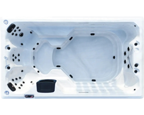 Aufnahme von oben eines rechteckigen Whirlpools mit integrierten Düsen.