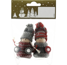 Geroma Logo. Zwei gestrickte Weihnachtspuppen in einer Verpackung.