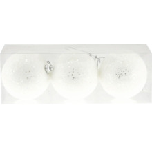 Drei weiße Weihnachtskugeln mit Glitzer in einer transparenten Verpackung.