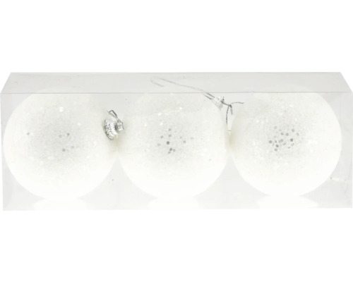 Drei weiße Weihnachtskugeln mit Glitzer in einer transparenten Verpackung.