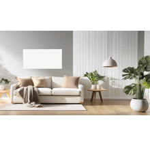Wohnzimmer mit Sofa, Kissen, Decke, Teppich, Pflanzen und Pendelleuchte