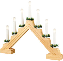 Schwibbogen aus Holz mit elektrischen Kerzen und Tannengrün