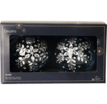 Zwei blaue Christbaumkugeln aus Glas mit Ornamenten in einer Verpackung