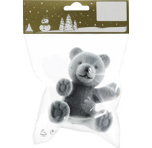 Grauer Teddybär im Plastikbeutel