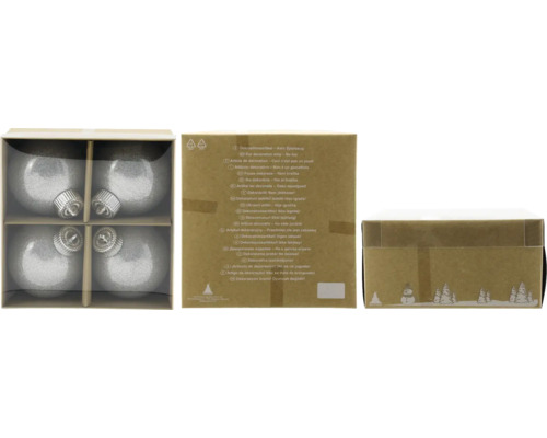 Vier silberne Christbaumkugeln in einer Verpackung