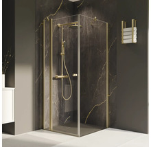 Eckdusche mit goldfarbenen Beschlägen und Handtuchhalter im Badezimmer