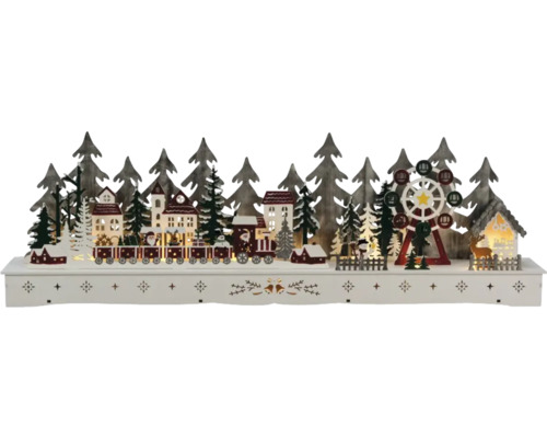 Dekorative hölzerne Weihnachtslandschaft mit Häusern, Bäumen, Eisenbahn und Riesenrad
