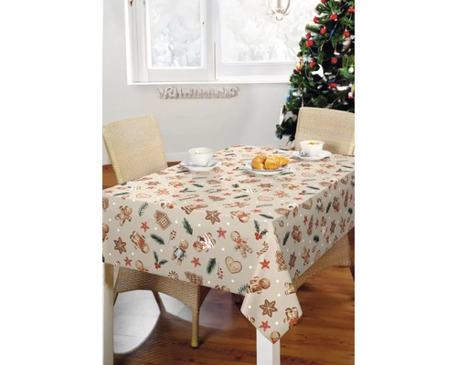 Weihnachtstisch mit Lebkuchenmuster auf Tischdecke