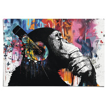 Dekorative Leinwand mit Affe und Kopfhörern als Motiv