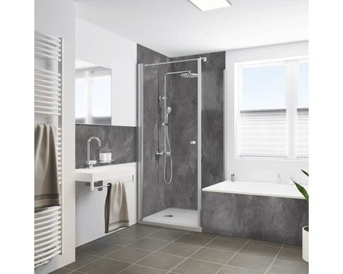 Badezimmer mit Duschkabine, Waschbecken, Heizkörper und Badewanne in hellem, modernem Design