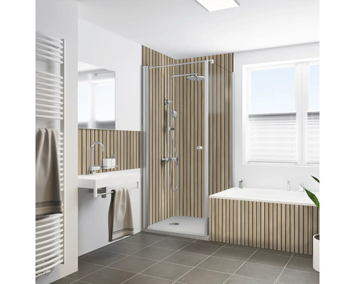 Badezimmer mit Duschkabine, Waschbecken, Heizkörper und Badewanne