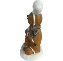 Dekorative Lebkuchenfiguren mit Schal und Mütze