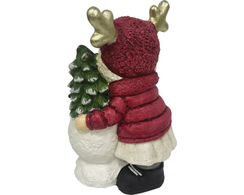 Dekorative Rentierfigur umarmt einen Weihnachtsbaum.