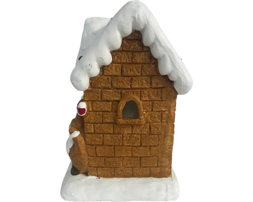 Dekoratives Lebkuchenhaus mit Schnee auf dem Dach.