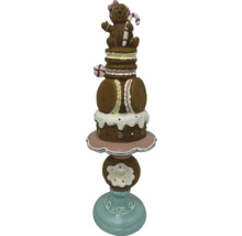 Dekorative Süßigkeitenfigur mit Lebkuchenmann, Makronen und Donut