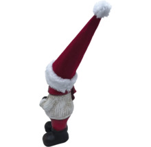 Weihnachtswichtel mit roter Mütze als Gartendekoration
