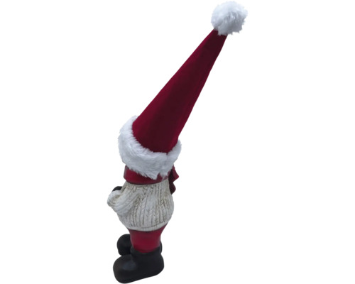 Weihnachtswichtel mit roter Mütze als Gartendekoration