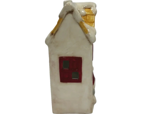 Dekoratives Haus aus Keramik mit Schnee auf dem Dach und Schornstein.