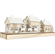Dekoratives Holzhaus mit Rentieren für die Weihnachtszeit
