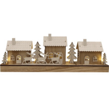 Dekorative Winterlandschaft mit Häusern, Bäumen und Rehen aus Holz