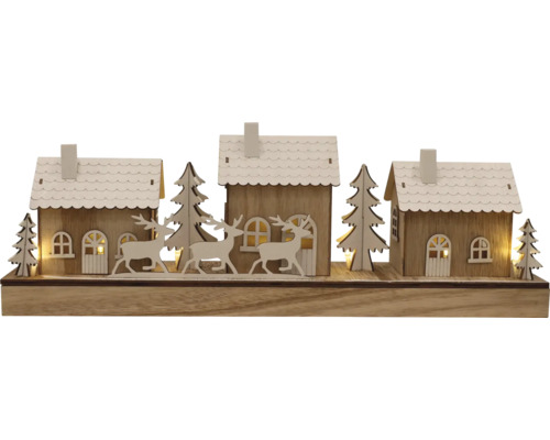 Dekorative Winterlandschaft mit Häusern, Bäumen und Rehen aus Holz