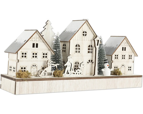 Weihnachtliche Holzdekoration mit Häusern, Bäumen und Figuren