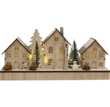Beleuchtete Holzdekoration mit Häusern, Tannenbäumen und Schneemann für die Weihnachtszeit