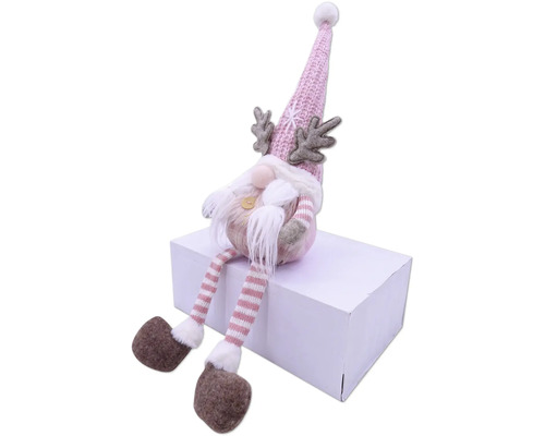 Dekorative Zwergfigur mit Mütze, Bart und Geweih auf einem Paket