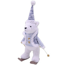 Dekorativer Teddybär mit Mütze und Skiern als Weihnachtsdekoration