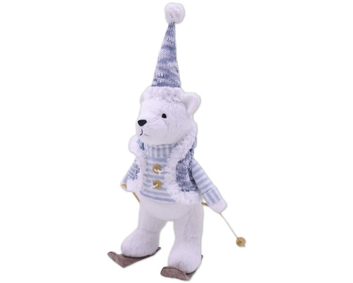 Dekorativer Teddybär mit Mütze und Skiern als Weihnachtsdekoration